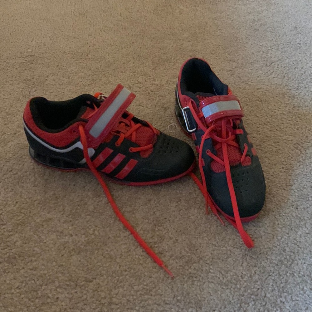 Size 6 mens weightlifting adidas red and black shoes.
